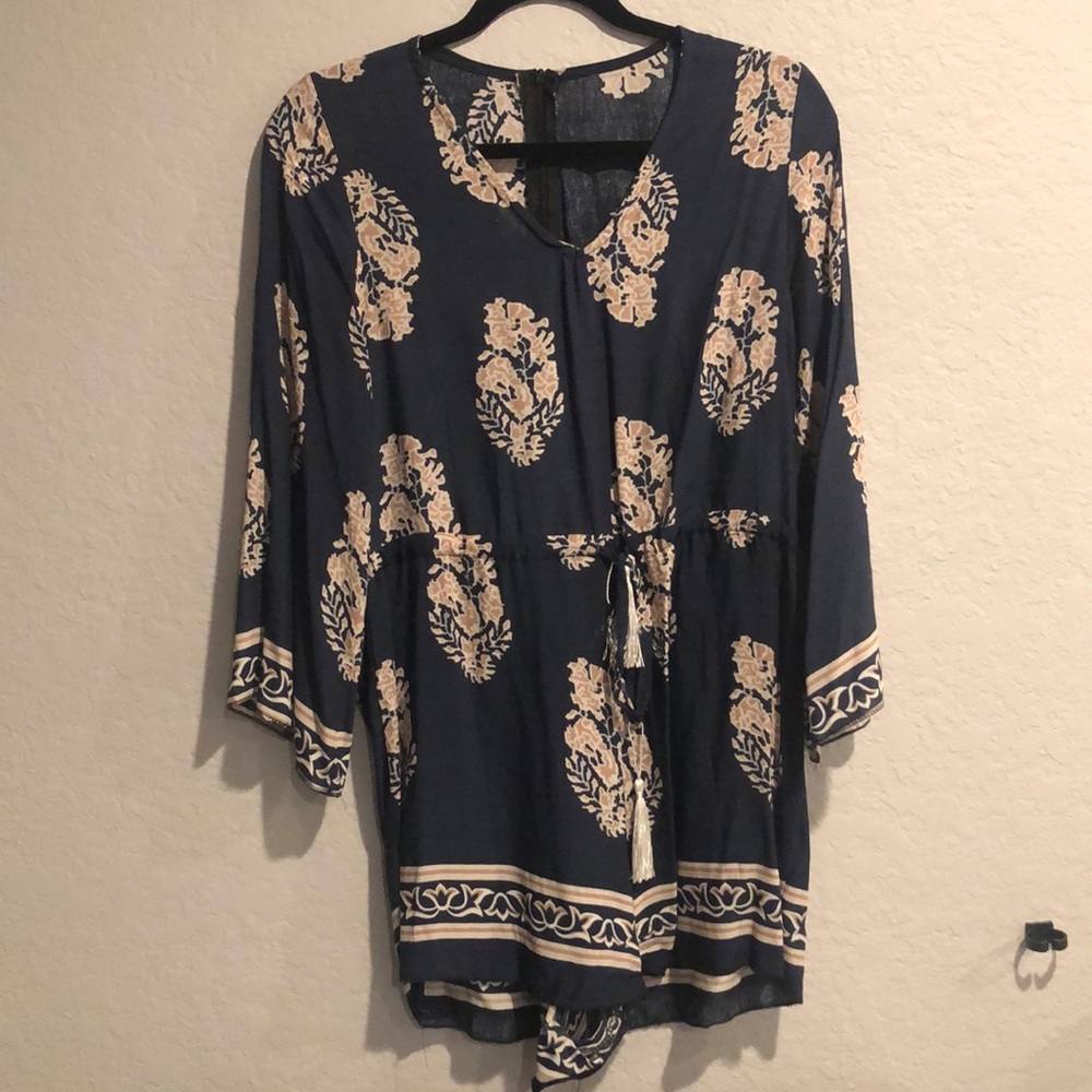 Blue romper with tan flowers